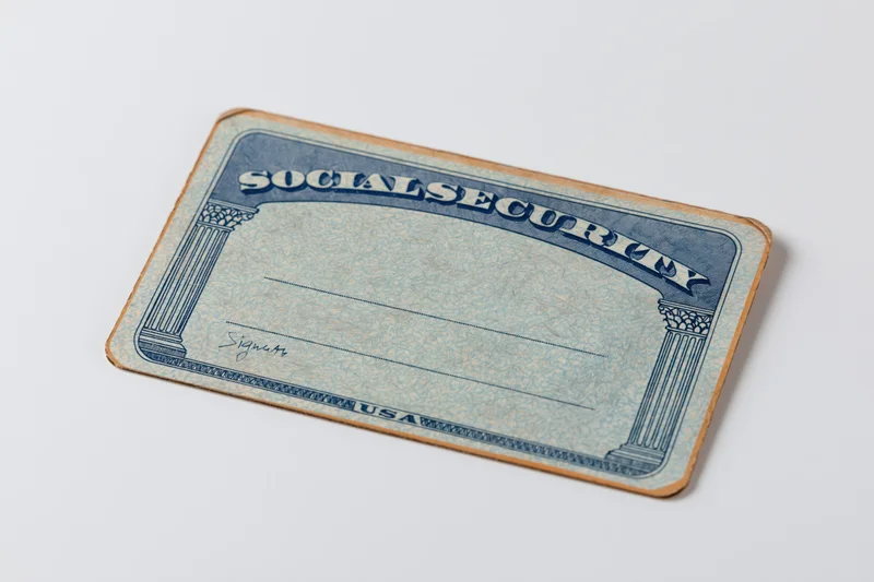 Blank us social security card lying flat on white surface