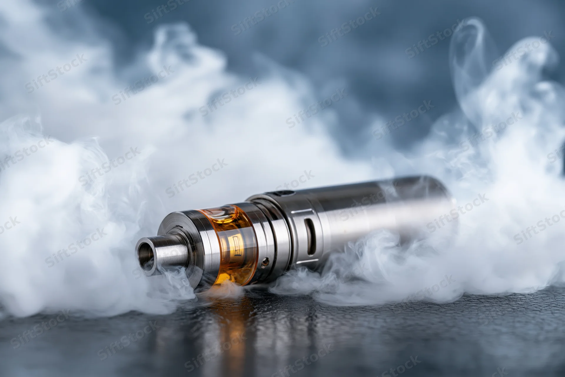 Cylindrical vape mod resting on dark textured surface surrounded by vapor