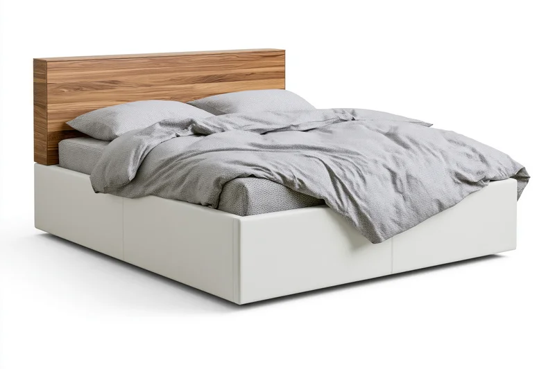 Double bed with white faux-leather frame and wooden headboard, made with gray bedding, isolated on white background