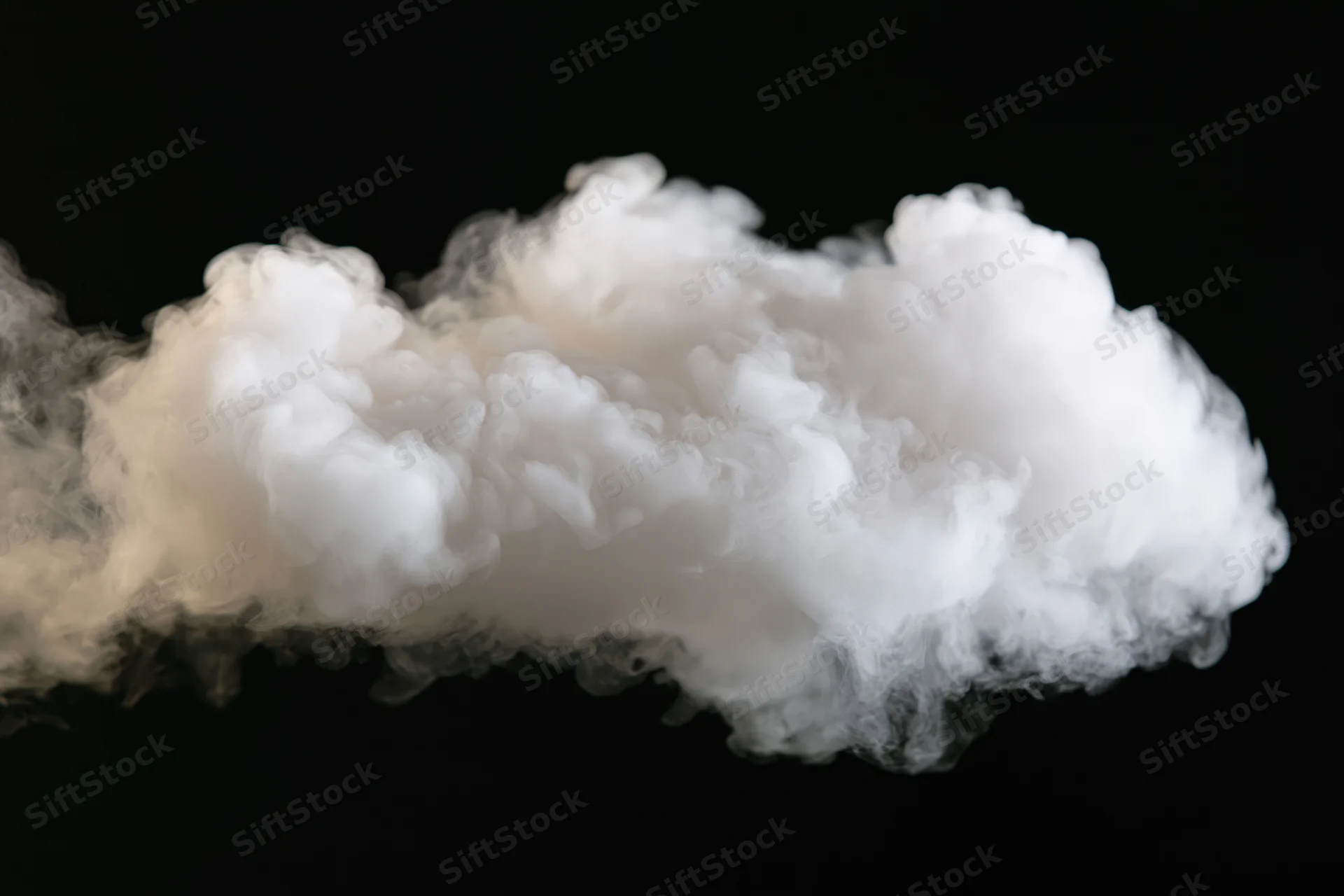White smoke drifting horizontally across black background