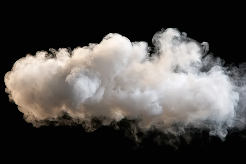 White smoke cloud drifting horizontally against black background