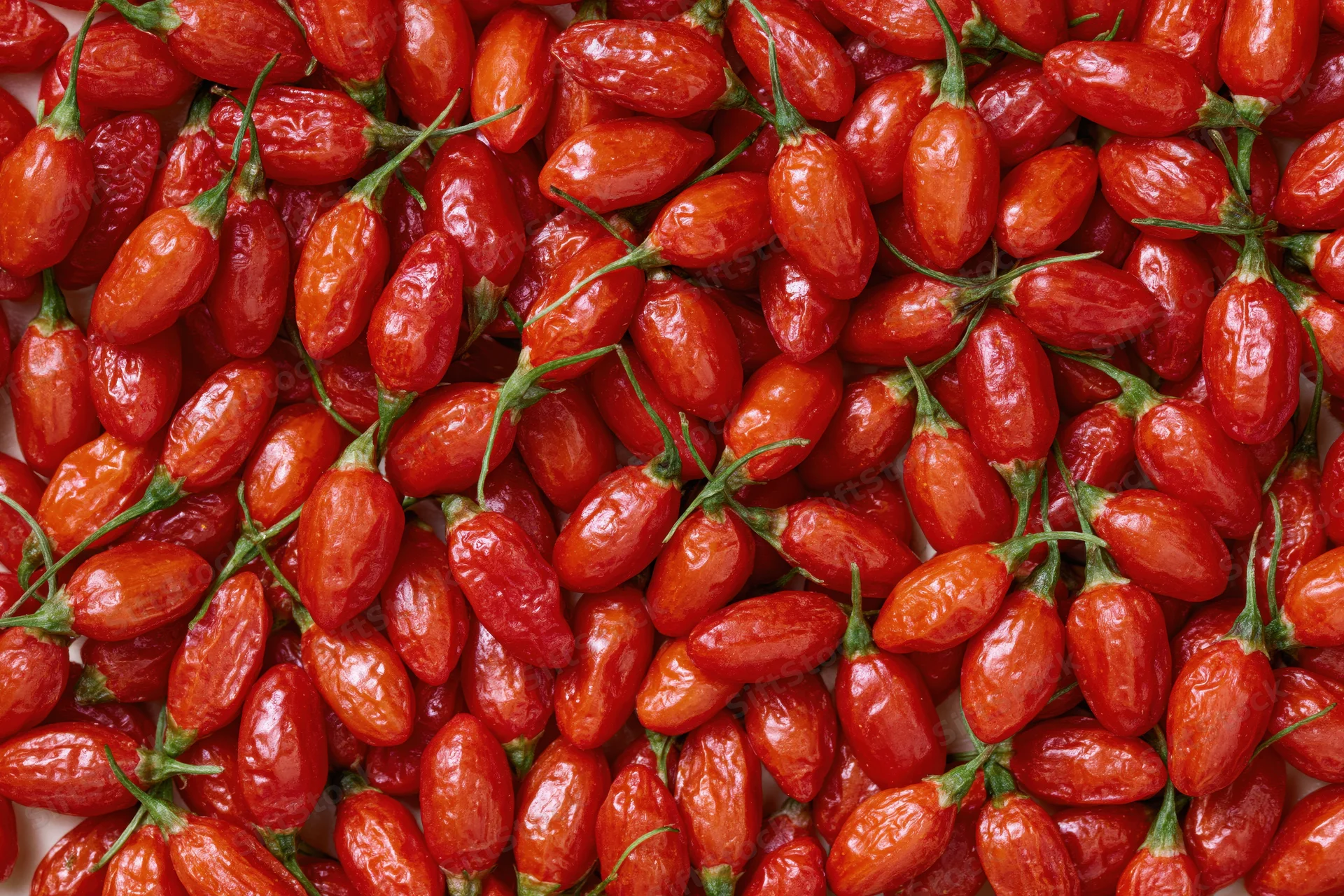 Close-up of dried goji berries piled together filling the frame