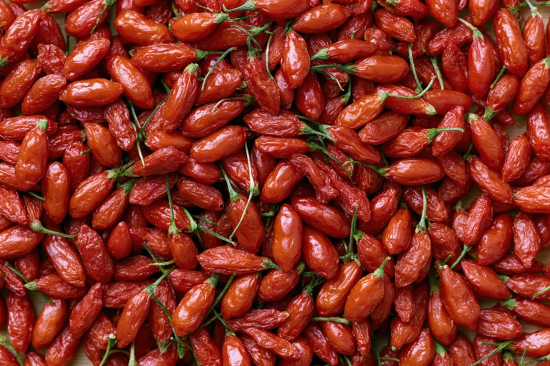 Dried goji berries piled closely together filling the frame