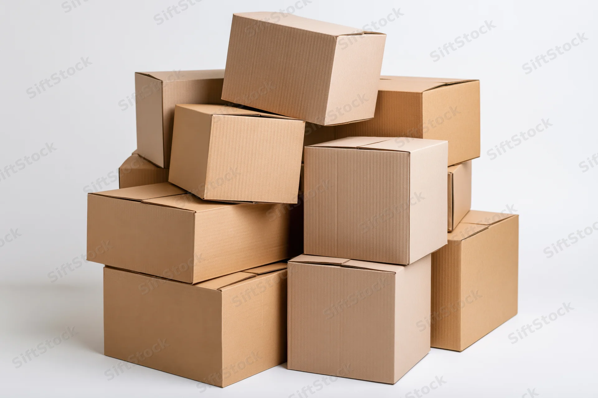 Stack of cardboard shipping boxes piled together on white background
