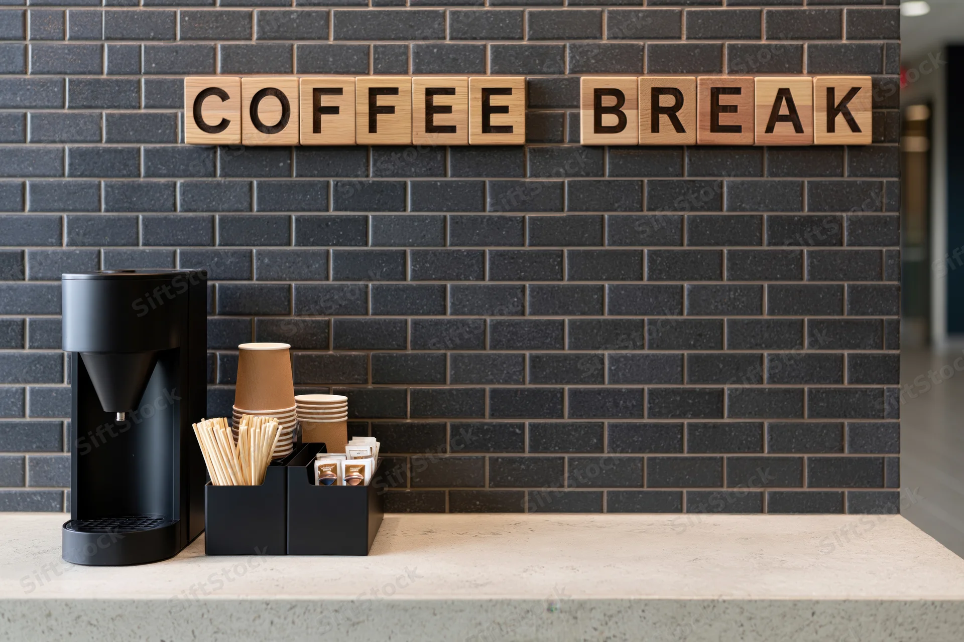 Self-serve coffee station with wooden sign on black brick wall and concrete counter