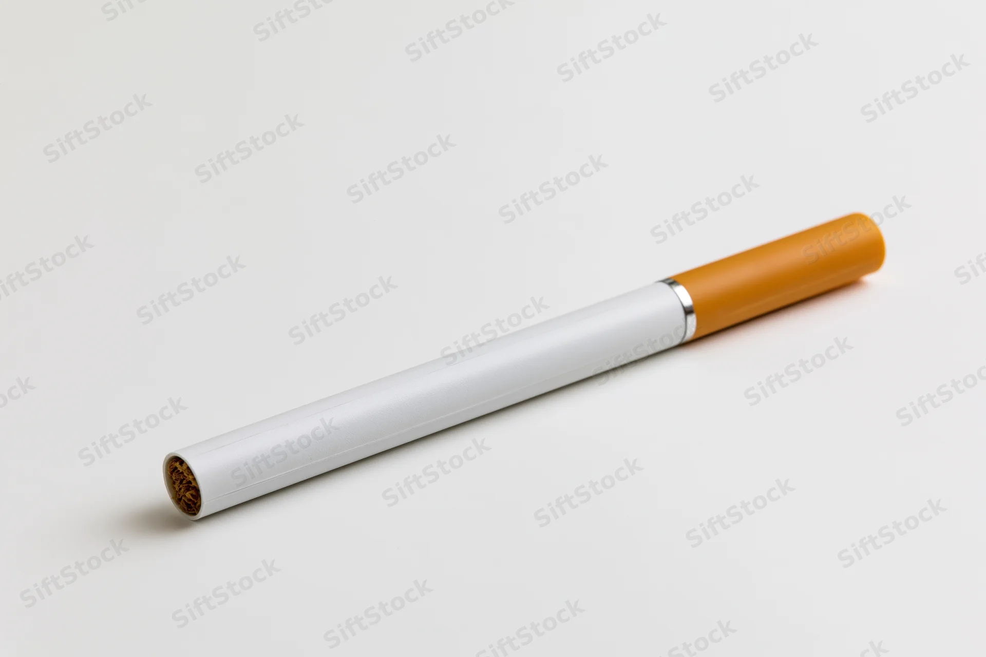 Electronic cigarette with white body and orange tip lying on white surface
