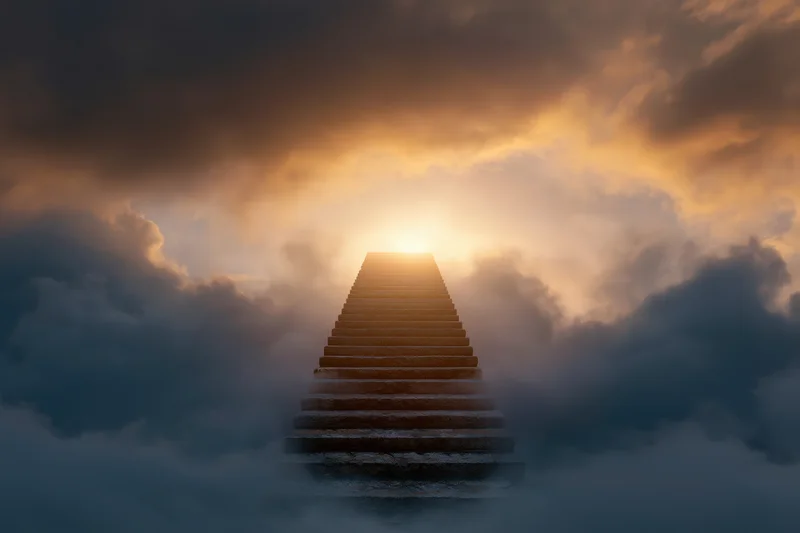 Stone staircase ascending through dense clouds toward a glowing sun in the sky