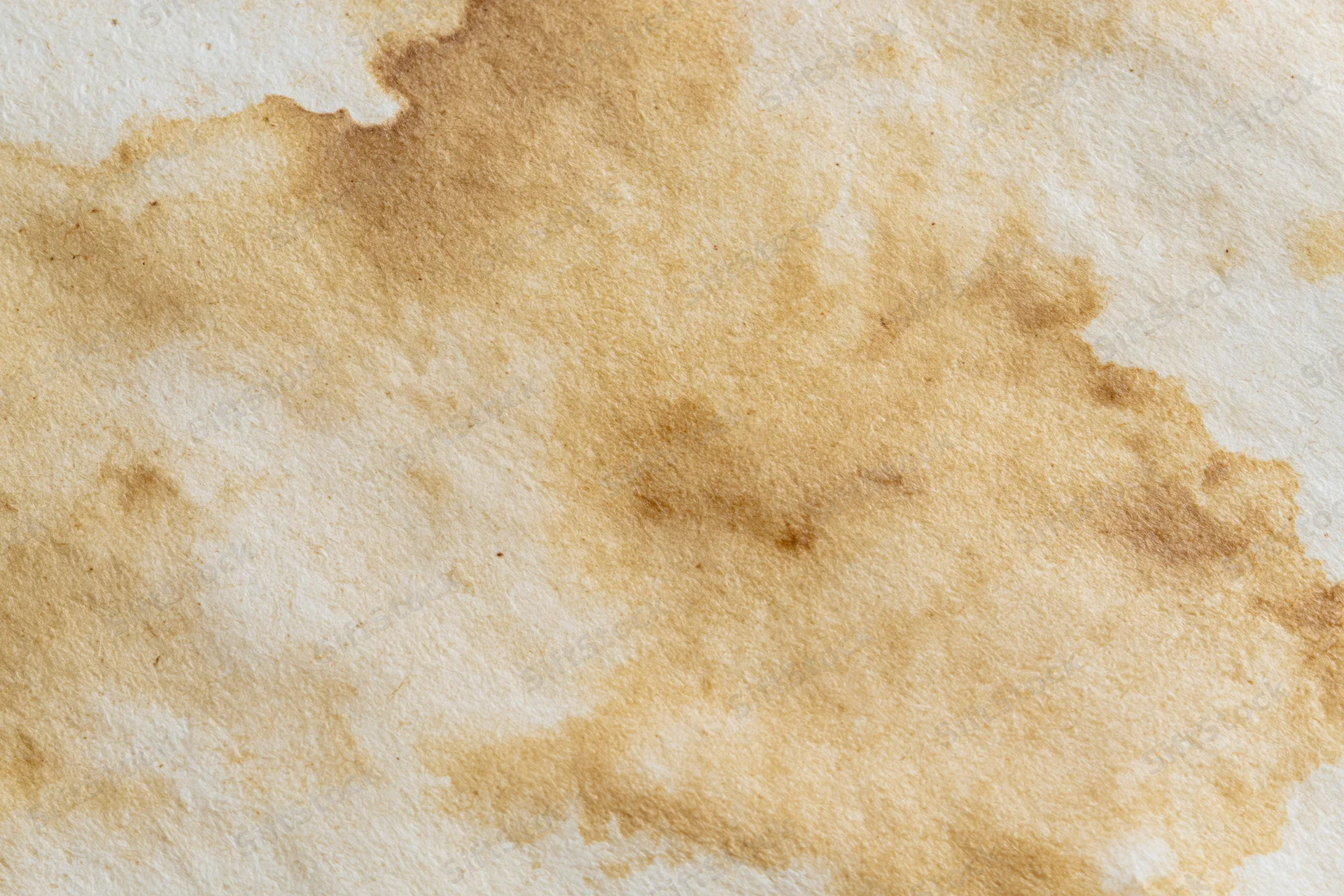 Aged paper surface with uneven brown water stains and faded texture
