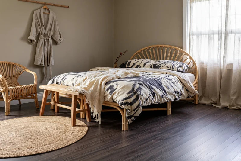 Bohemian bedroom with rattan double bed and natural decor
