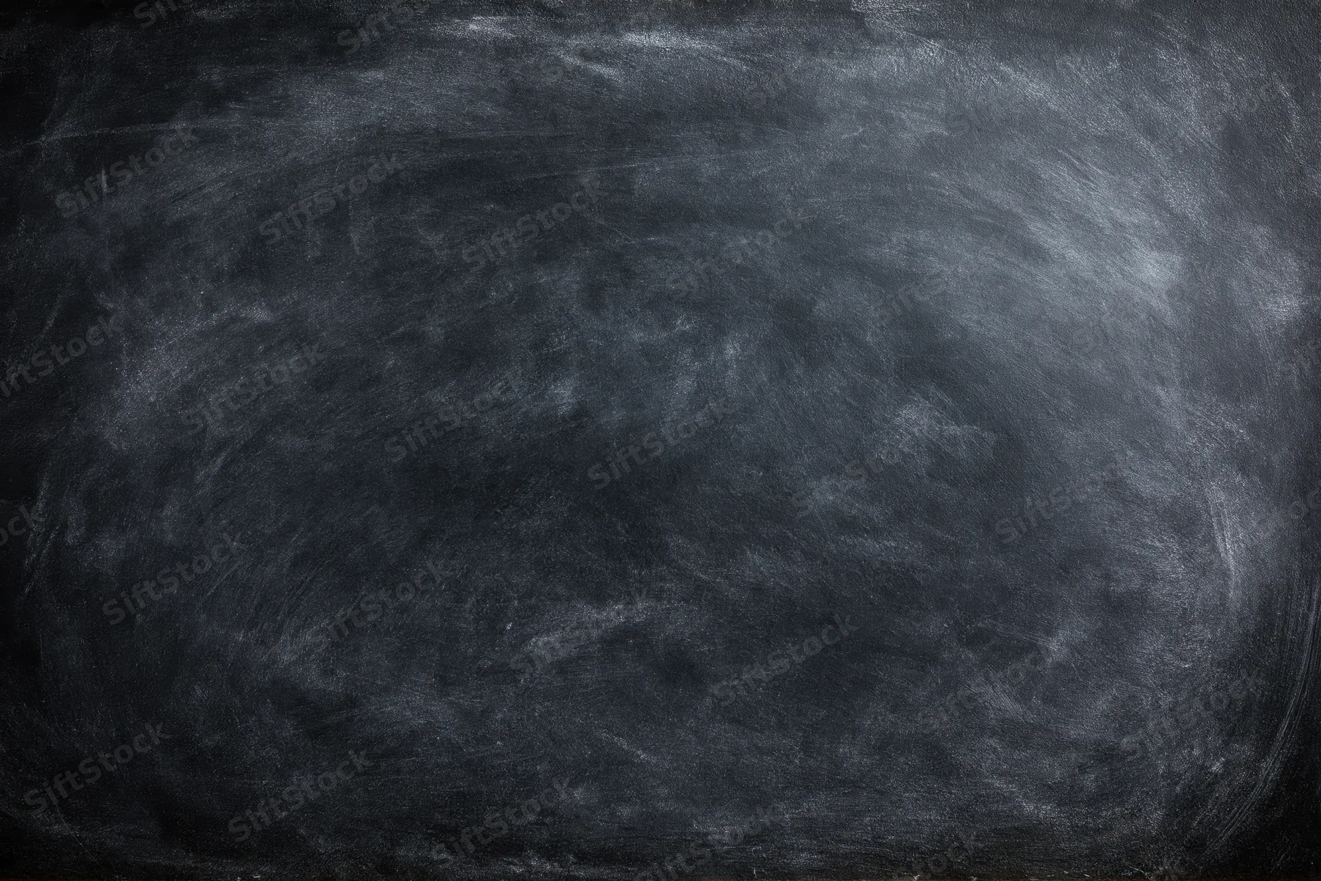 Close-up of a blank black chalkboard surface with smudged white residue, flat lay view