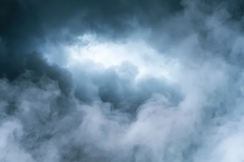 Dense billowing smoke filling the frame with a glowing center and dark swirling edges