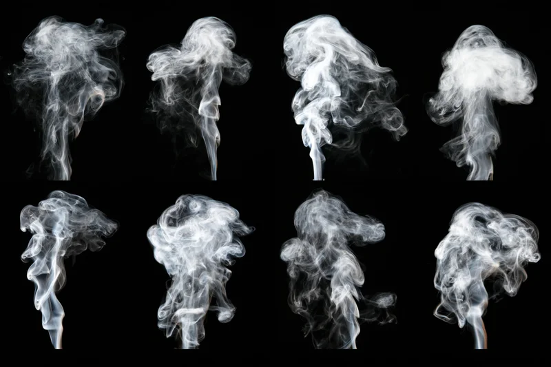 Eight white smoke plumes rising and swirling against a black background