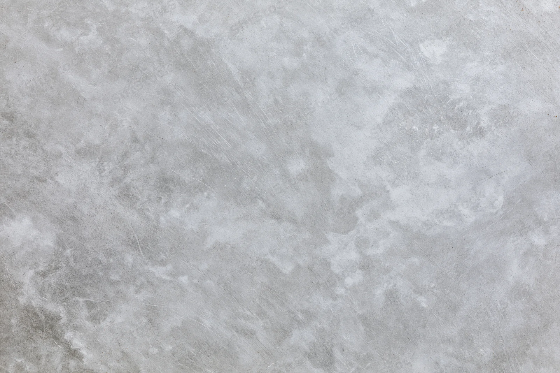 Close-up of a weathered gray concrete surface filling the frame