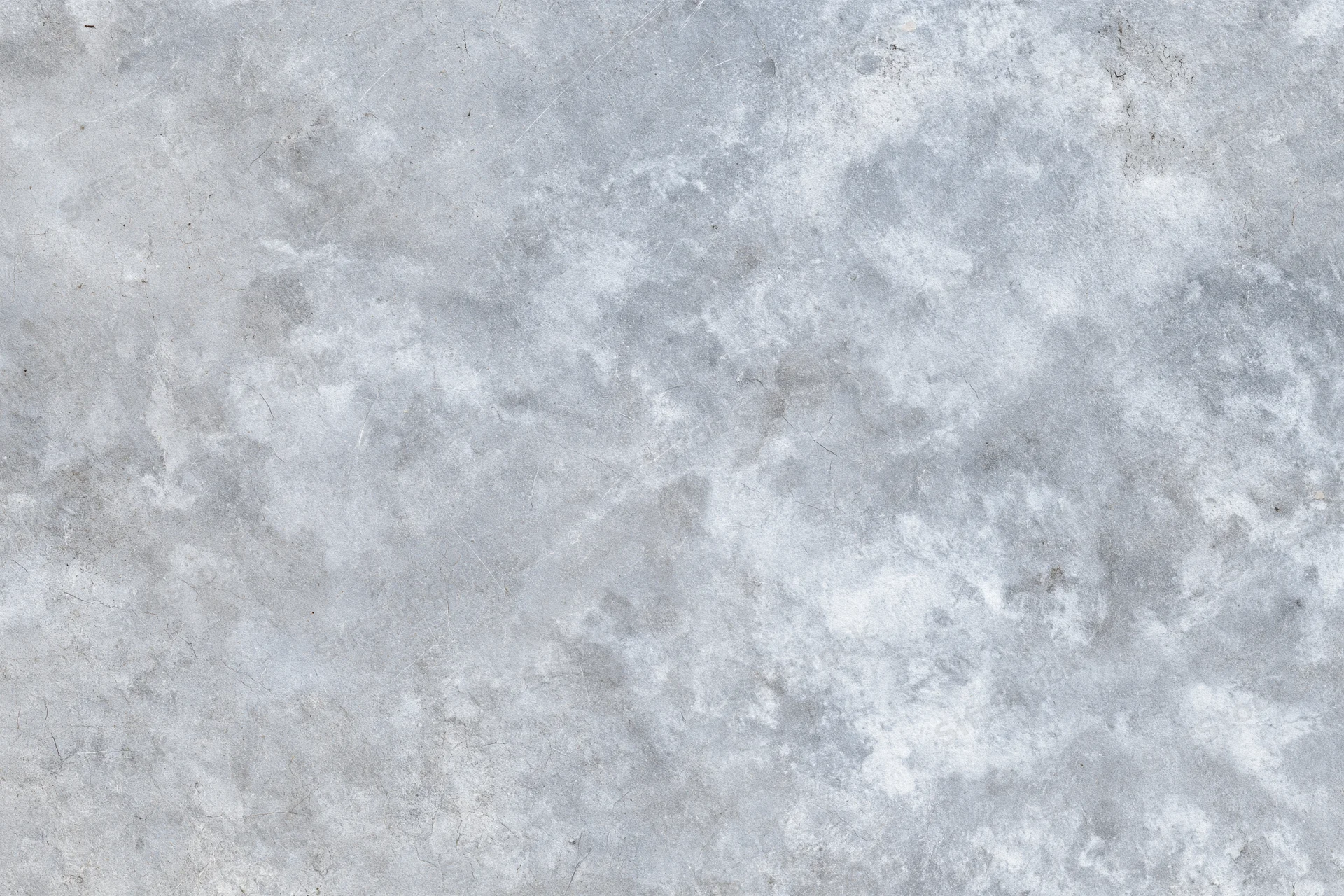 Flat gray concrete surface filling the frame with rough texture and subtle imperfections