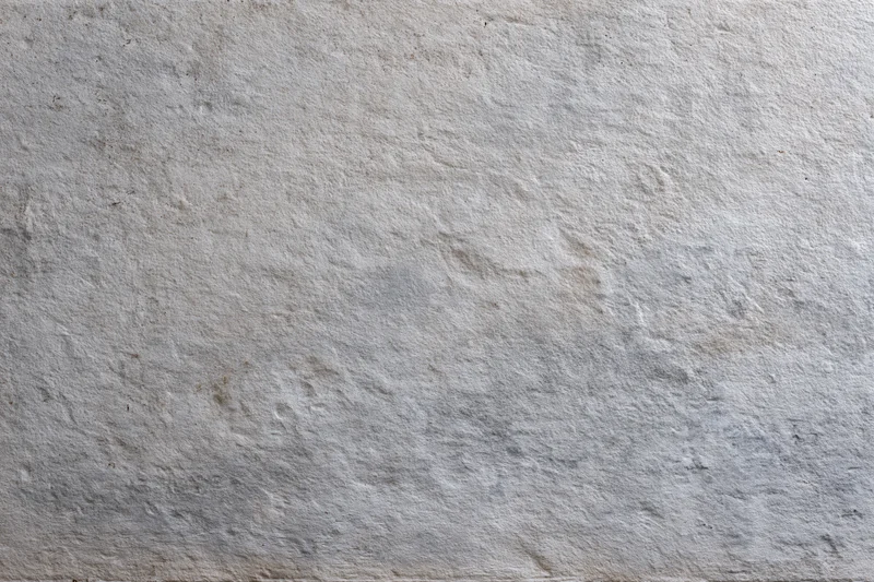 Close-up of a rough concrete wall surface filling the frame