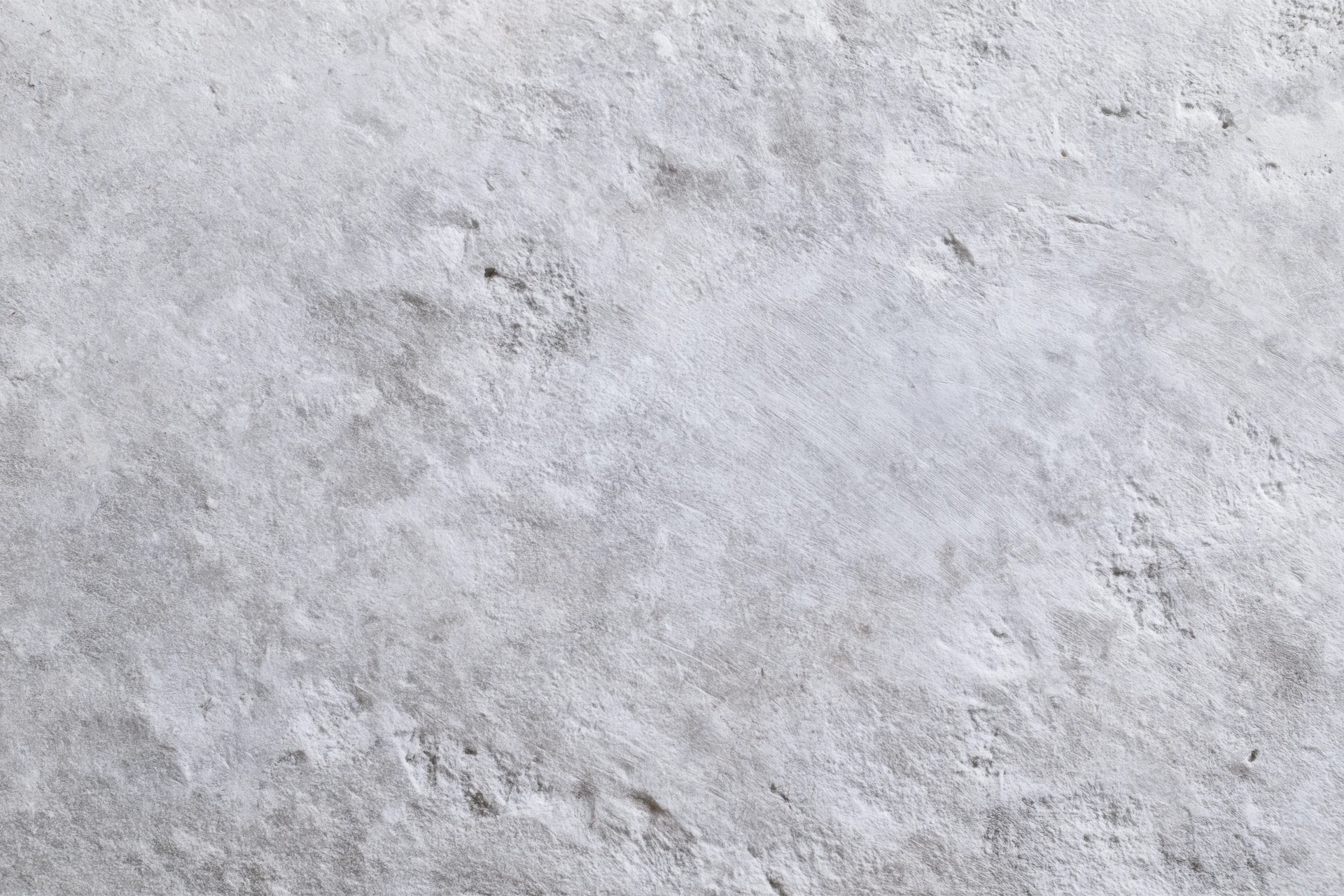 Close-up of a rough gray concrete wall surface filling the frame