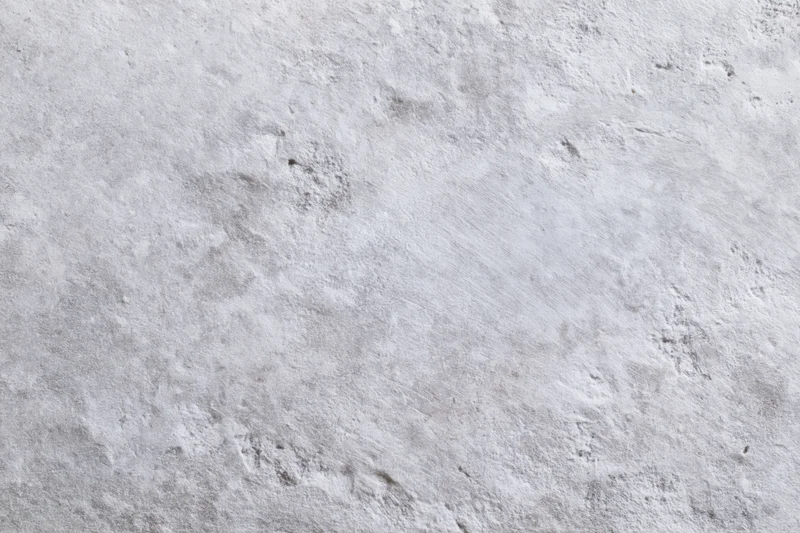 Close-up of a rough gray concrete wall surface filling the frame