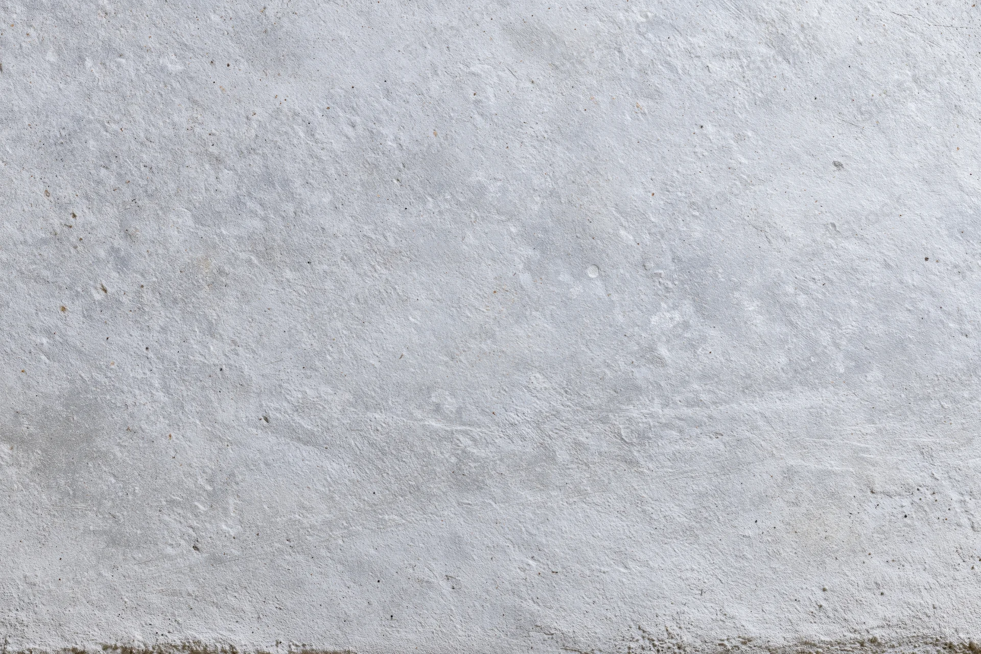 Textured concrete wall surface filling the frame