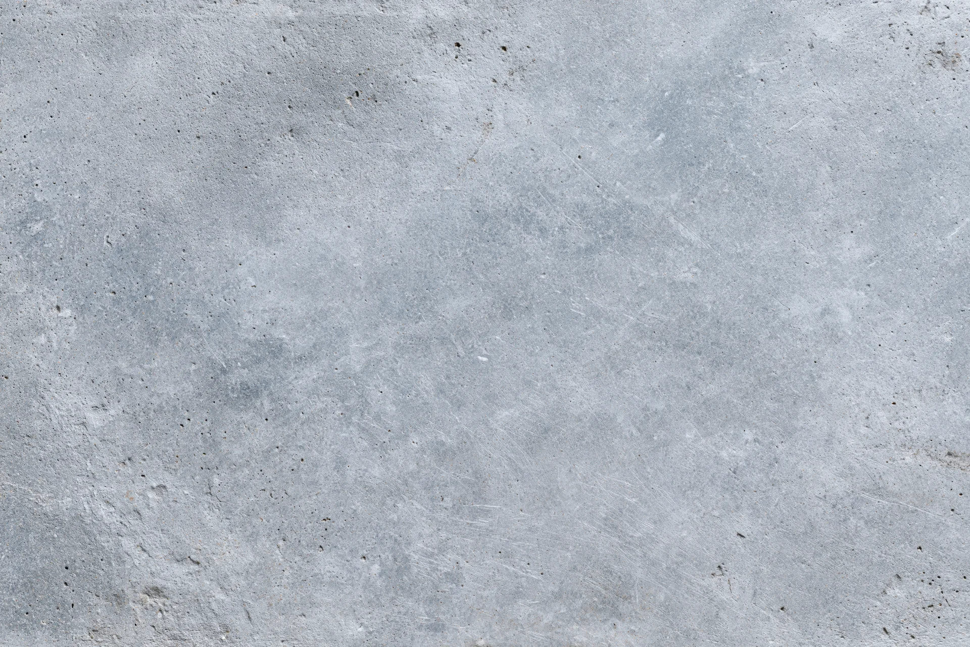 Flat gray concrete wall surface filling the frame