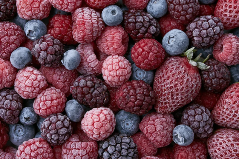 Frozen mixed berries filling the frame in closeup view
