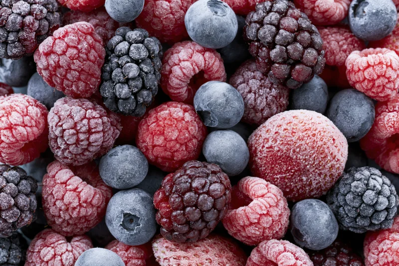 Frozen mixed berries filling the frame in closeup view
