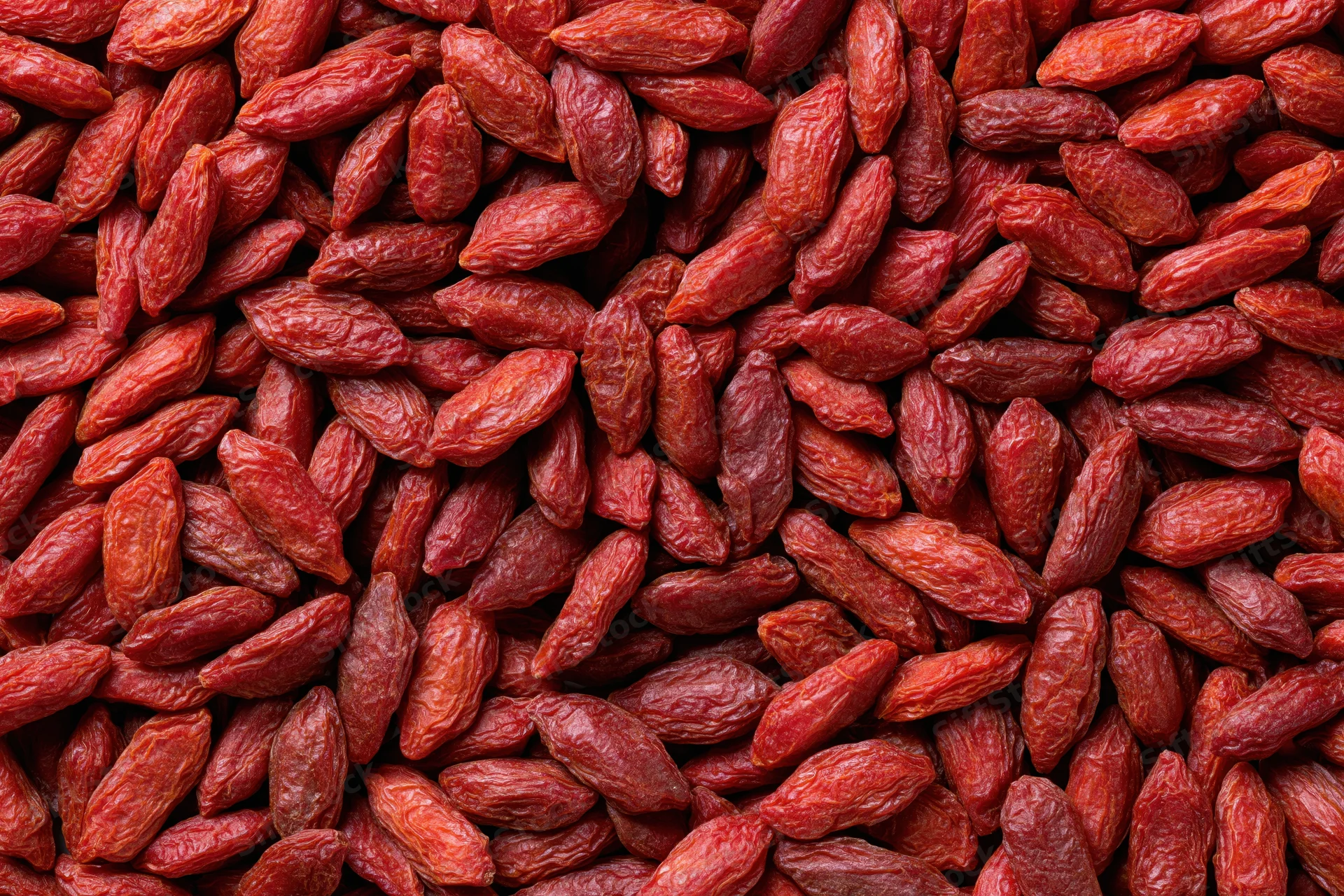 Dried goji berries filling the frame as a textured background
