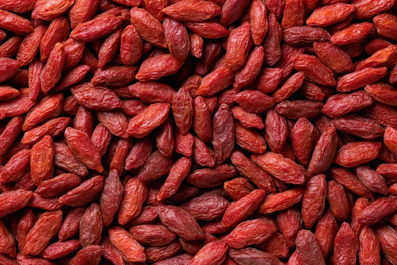 Dried goji berries filling the frame as a textured background