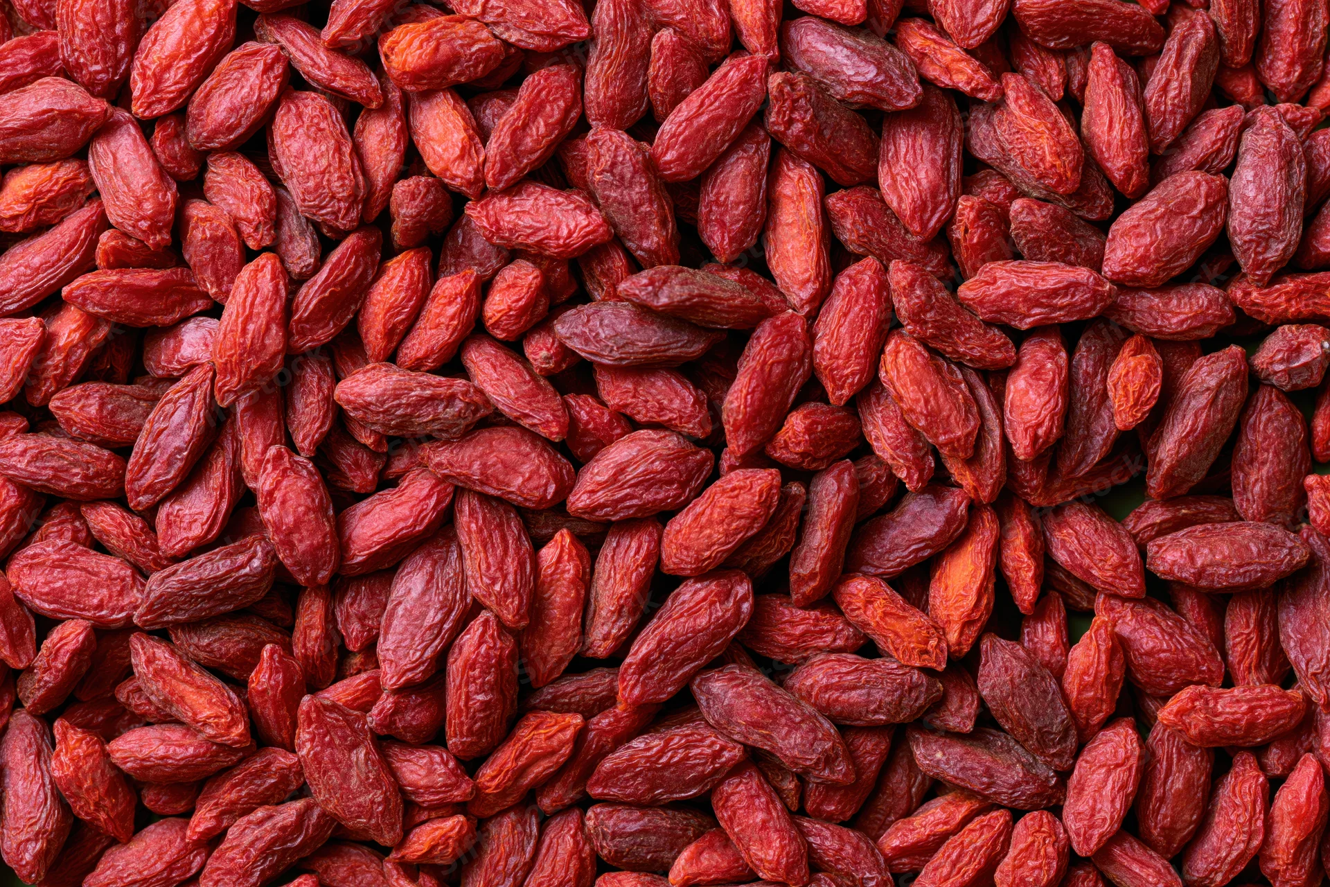 Dried goji berries filling the frame as a textured background