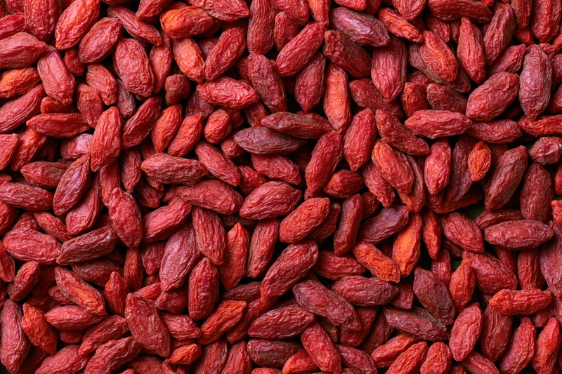Dried goji berries filling the frame as a textured background