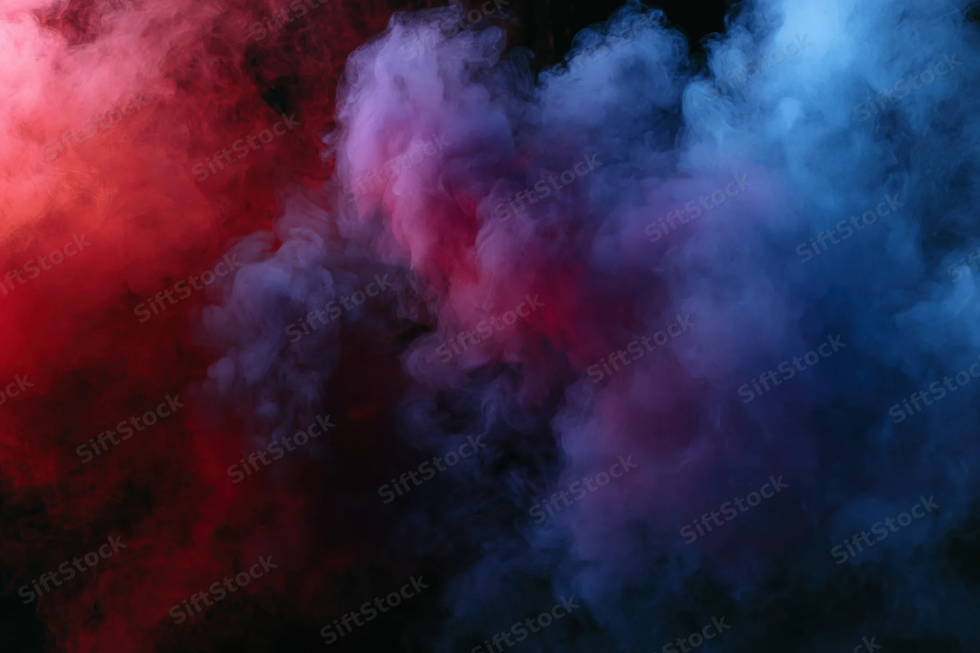 Swirling red and blue smoke filling the frame against a black background