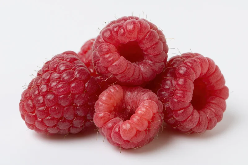 Cluster of fresh raspberries on white background