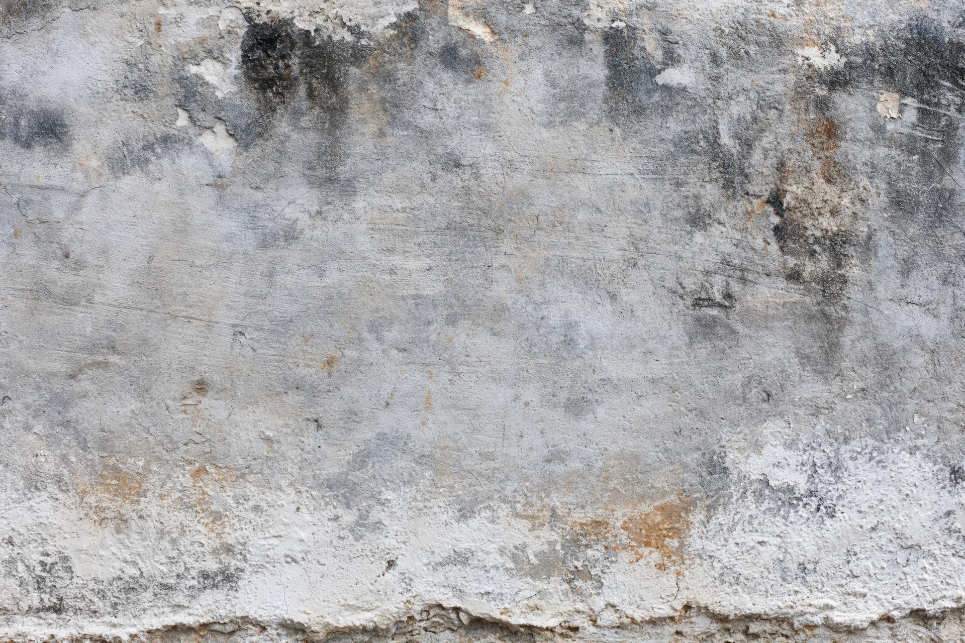 Weathered concrete wall surface filling the frame
