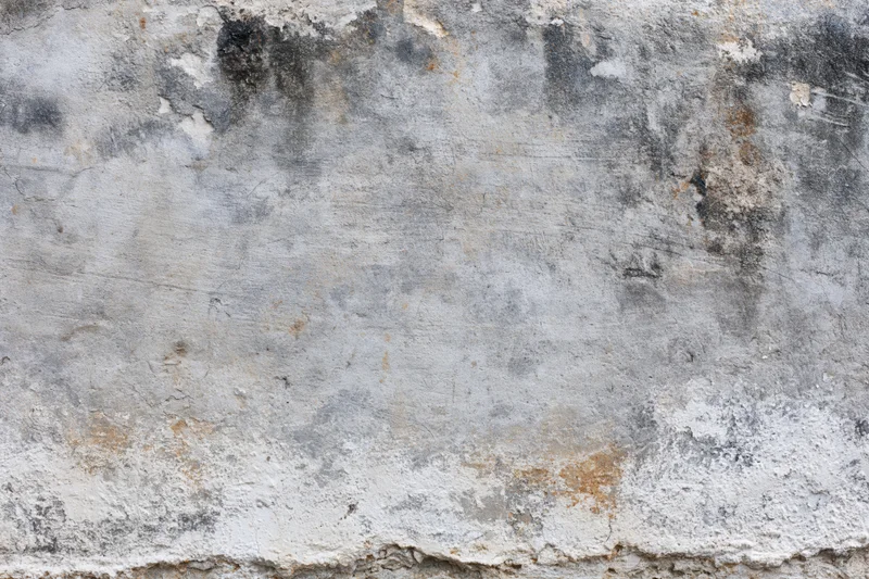 Weathered concrete wall surface filling the frame