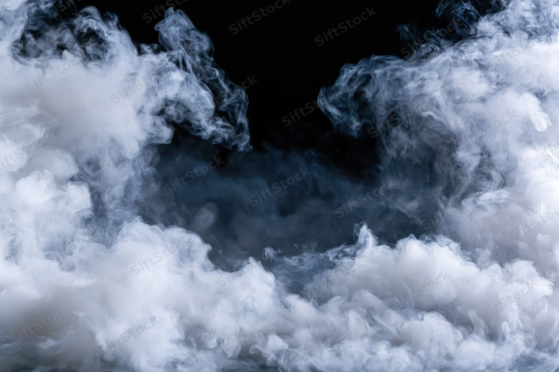 White smoke billowing upward along the left and right edges against a black background