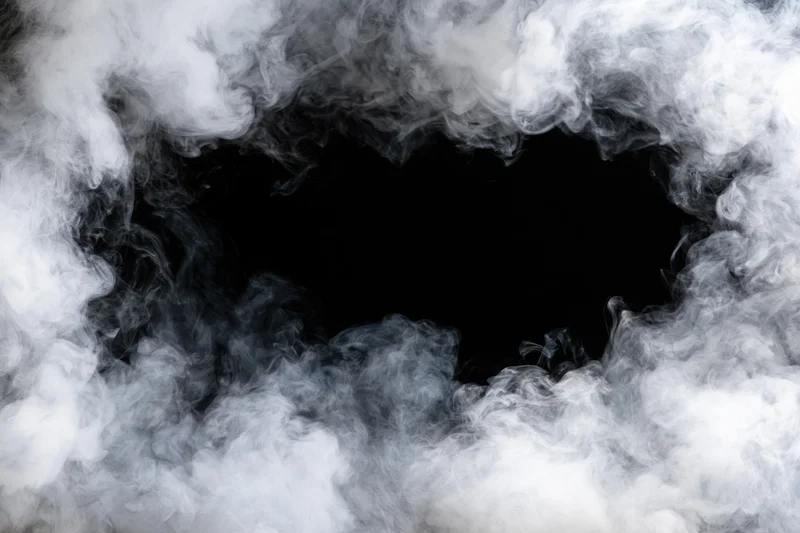 White smoke swirling around a black circular opening in the center
