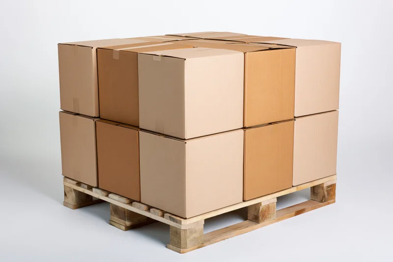 Stack of cardboard boxes on wooden shipping pallet