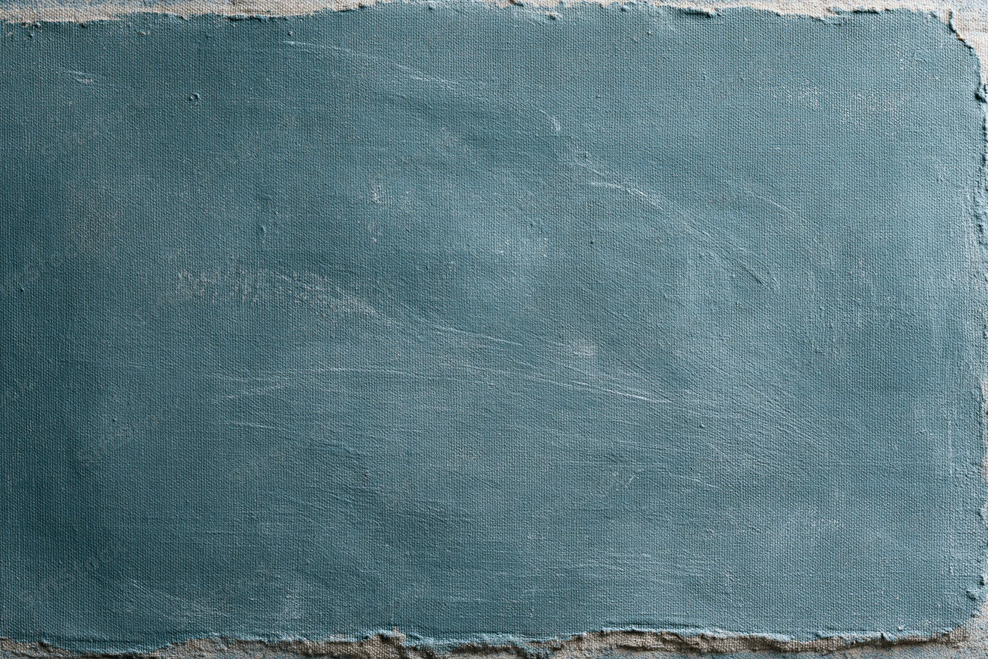 Worn teal-painted canvas surface filling the frame