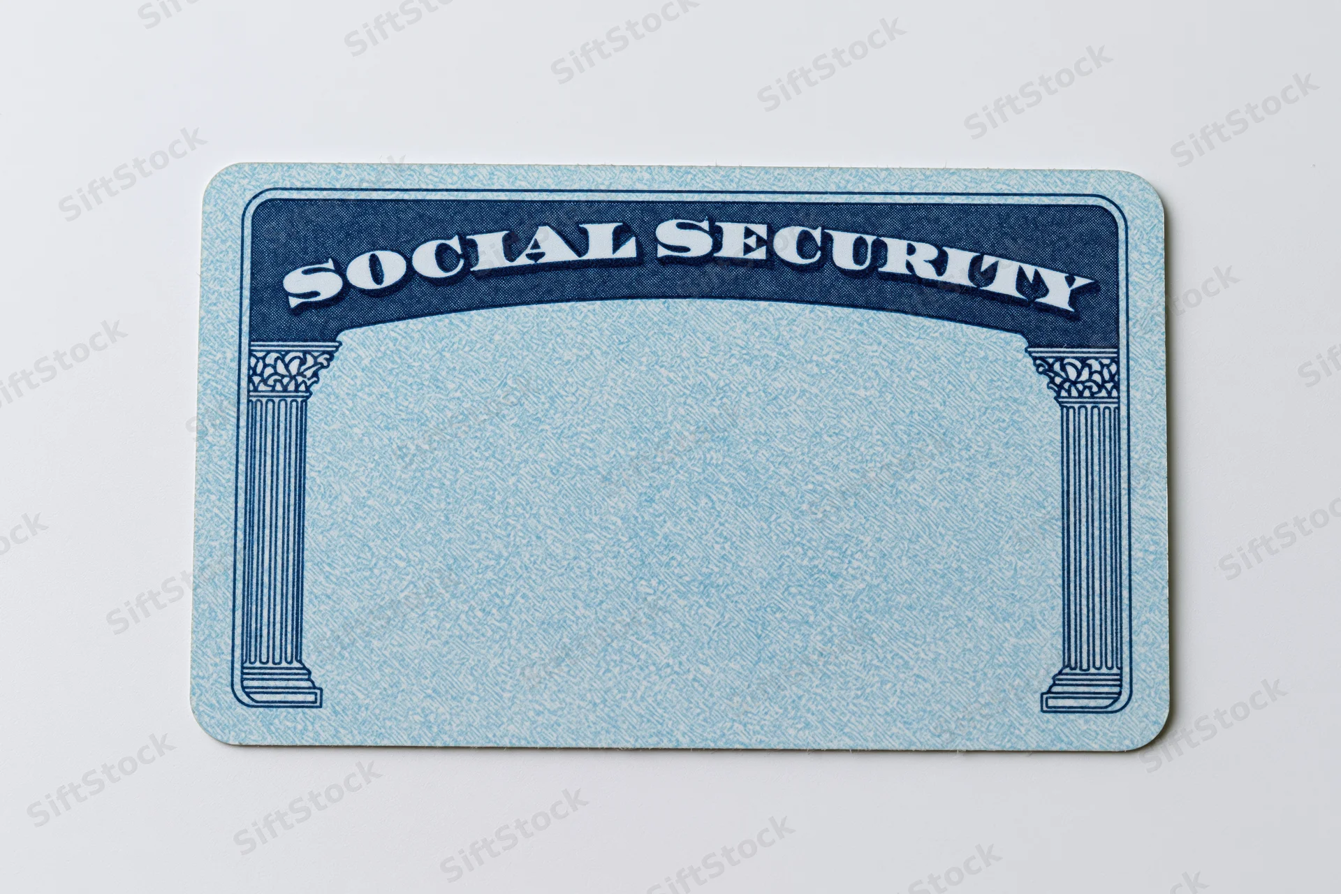 Blank us social security card lying flat on white background