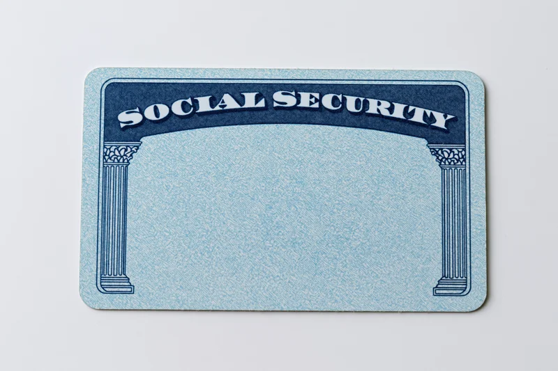 Blank us social security card lying flat on white background
