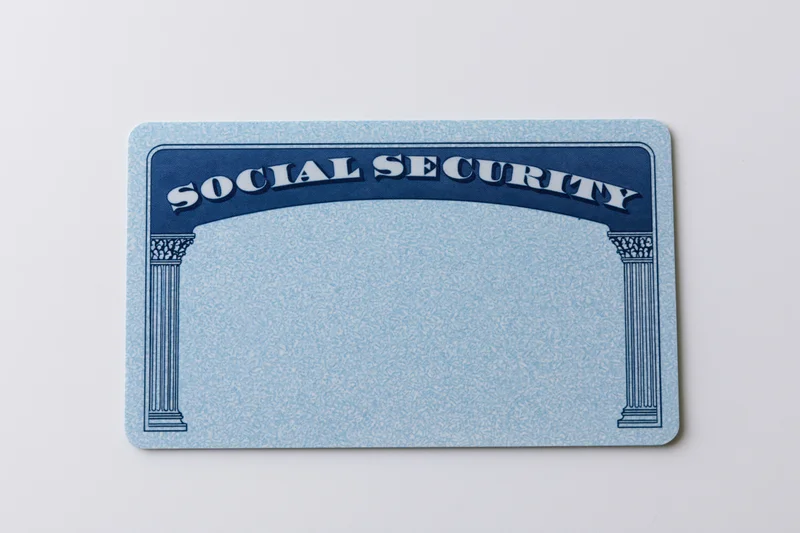 Blank us social security card lying flat on white surface