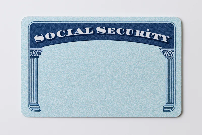 Blank us social security card lying flat on white background