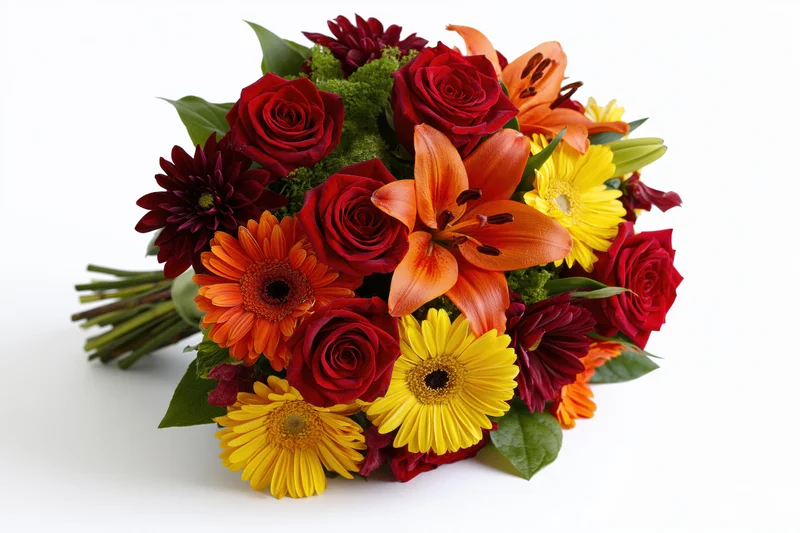 Hand-tied bouquet of red roses, orange lilies, and yellow gerbera daisies on white background