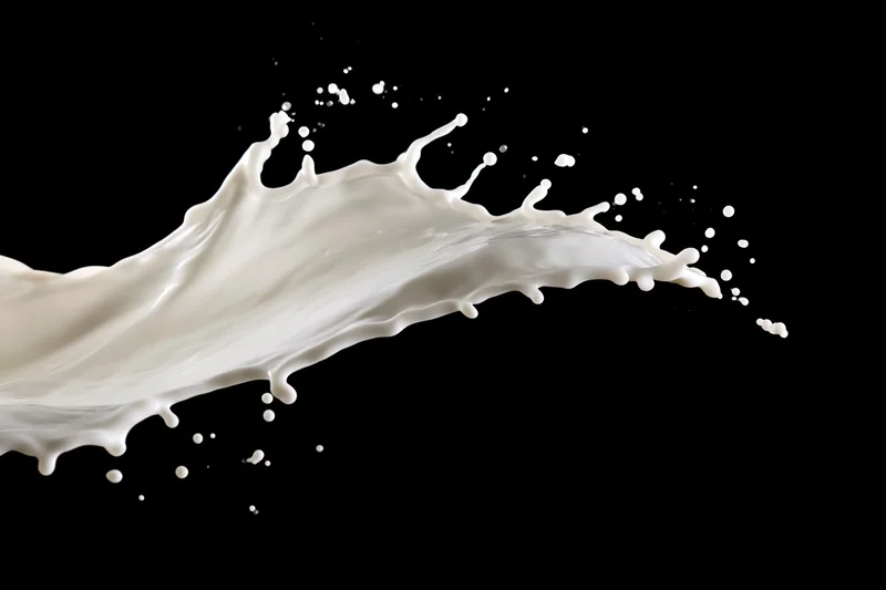 Milk splash frozen in motion against black background