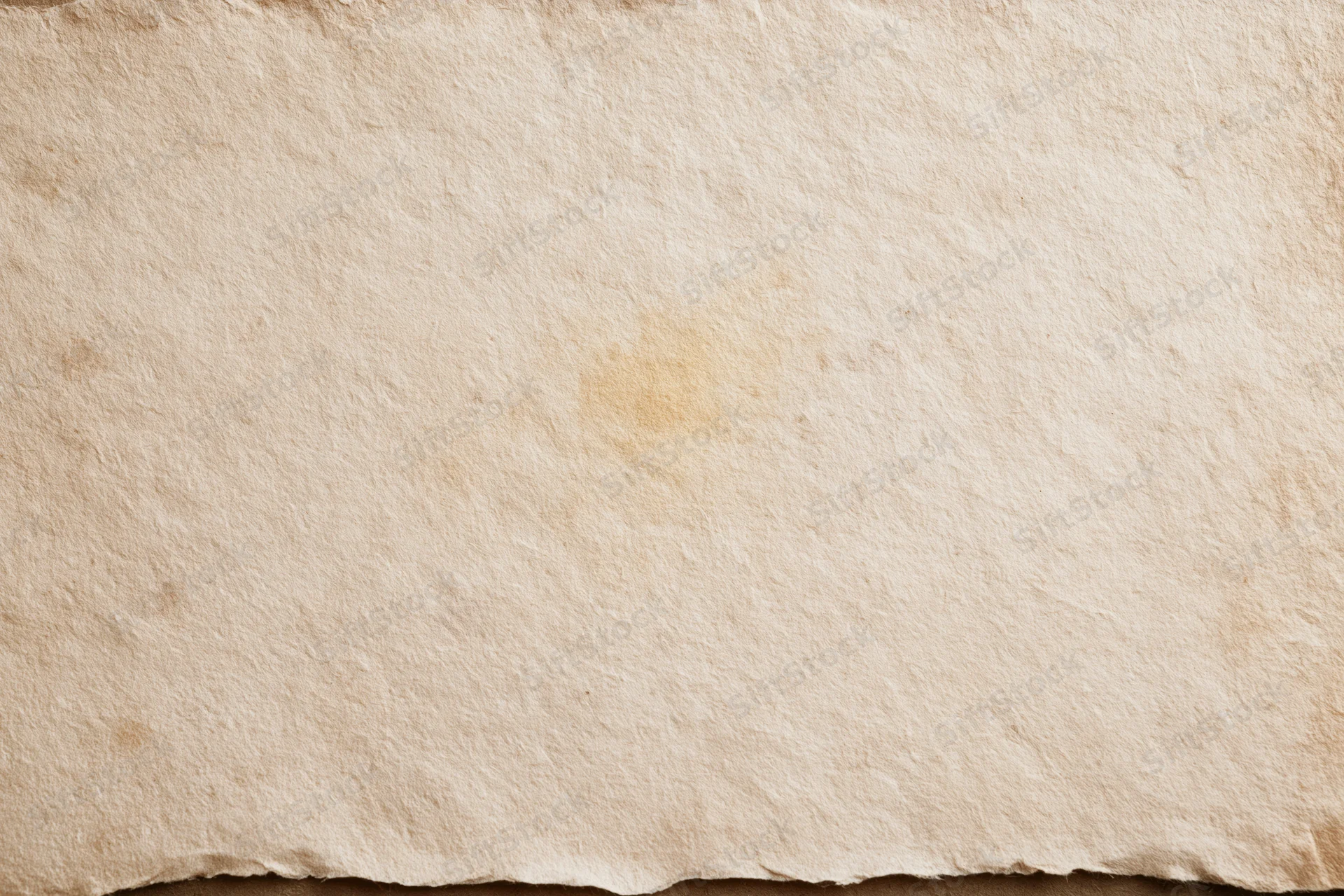 Aged paper sheet with textured surface and torn edge filling the frame