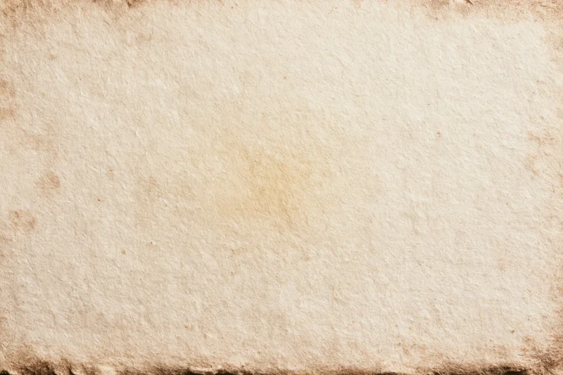 Aged paper sheet with textured surface and worn edges filling the frame
