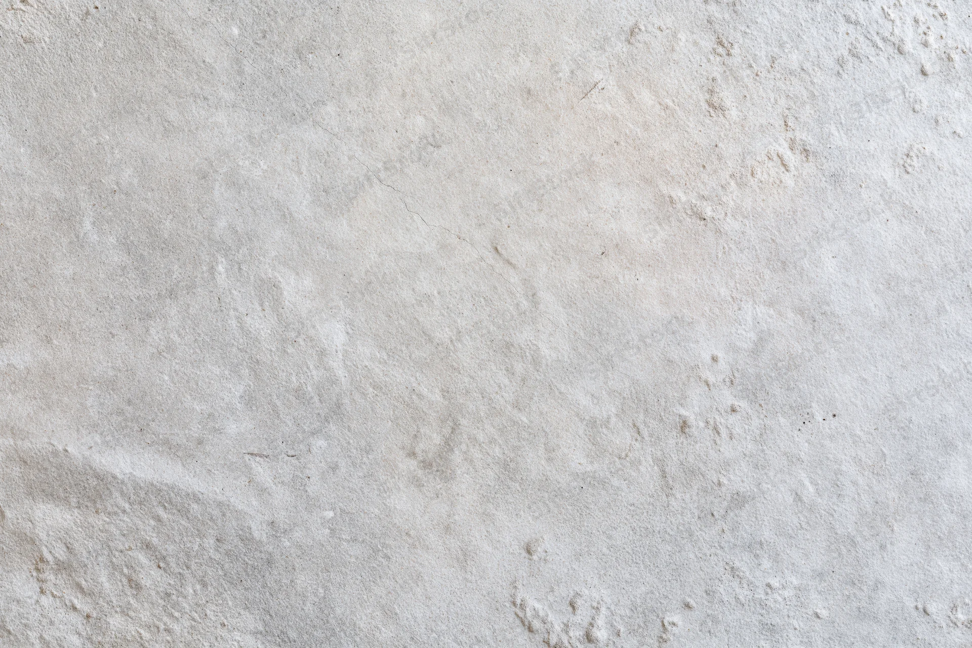 Close-up of a bare concrete wall surface with rough texture and subtle imperfections