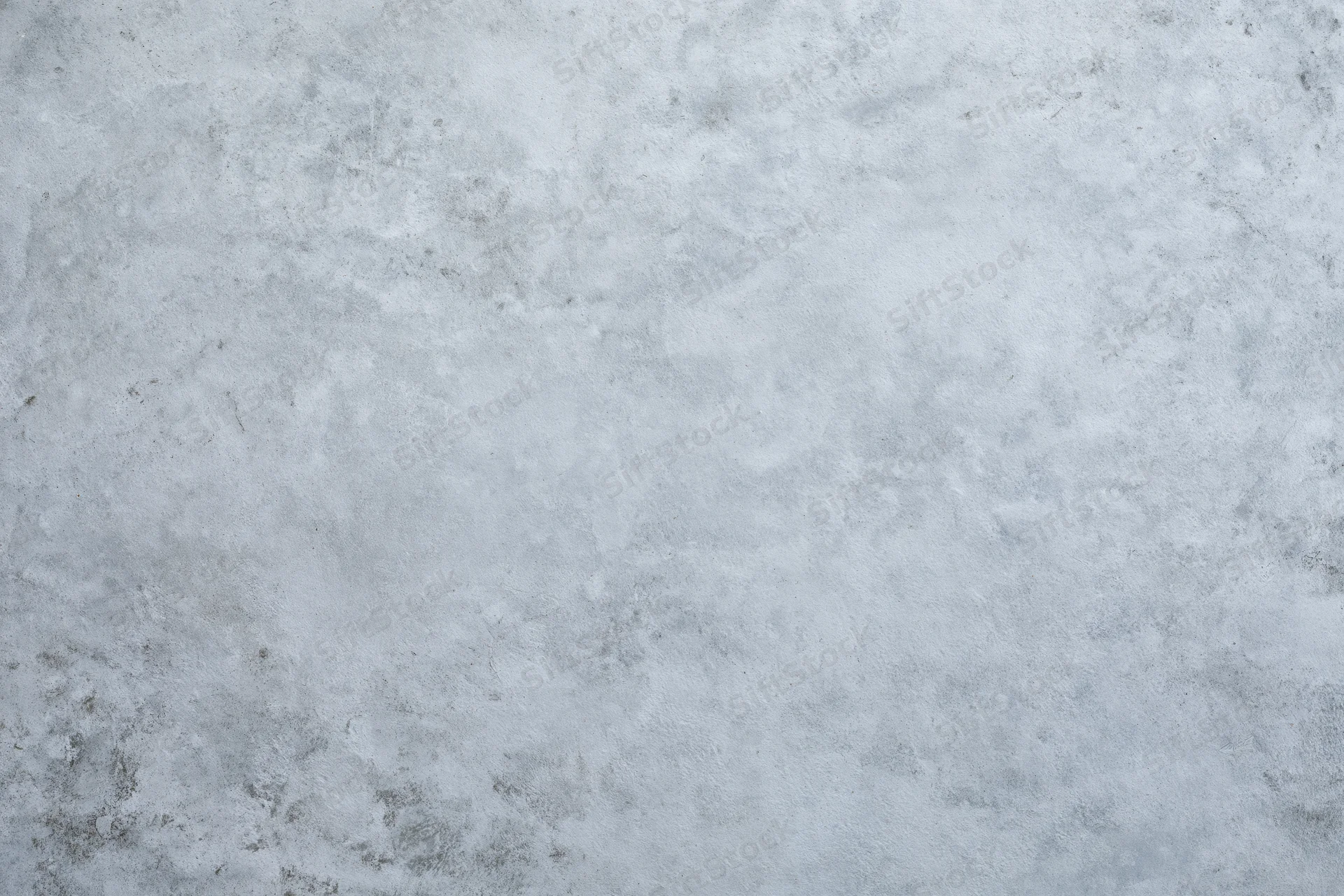 Close-up of a rough gray concrete wall surface filling the frame
