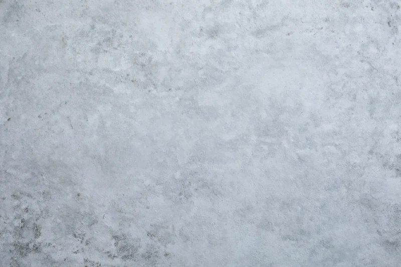 Close-up of a rough gray concrete wall surface filling the frame