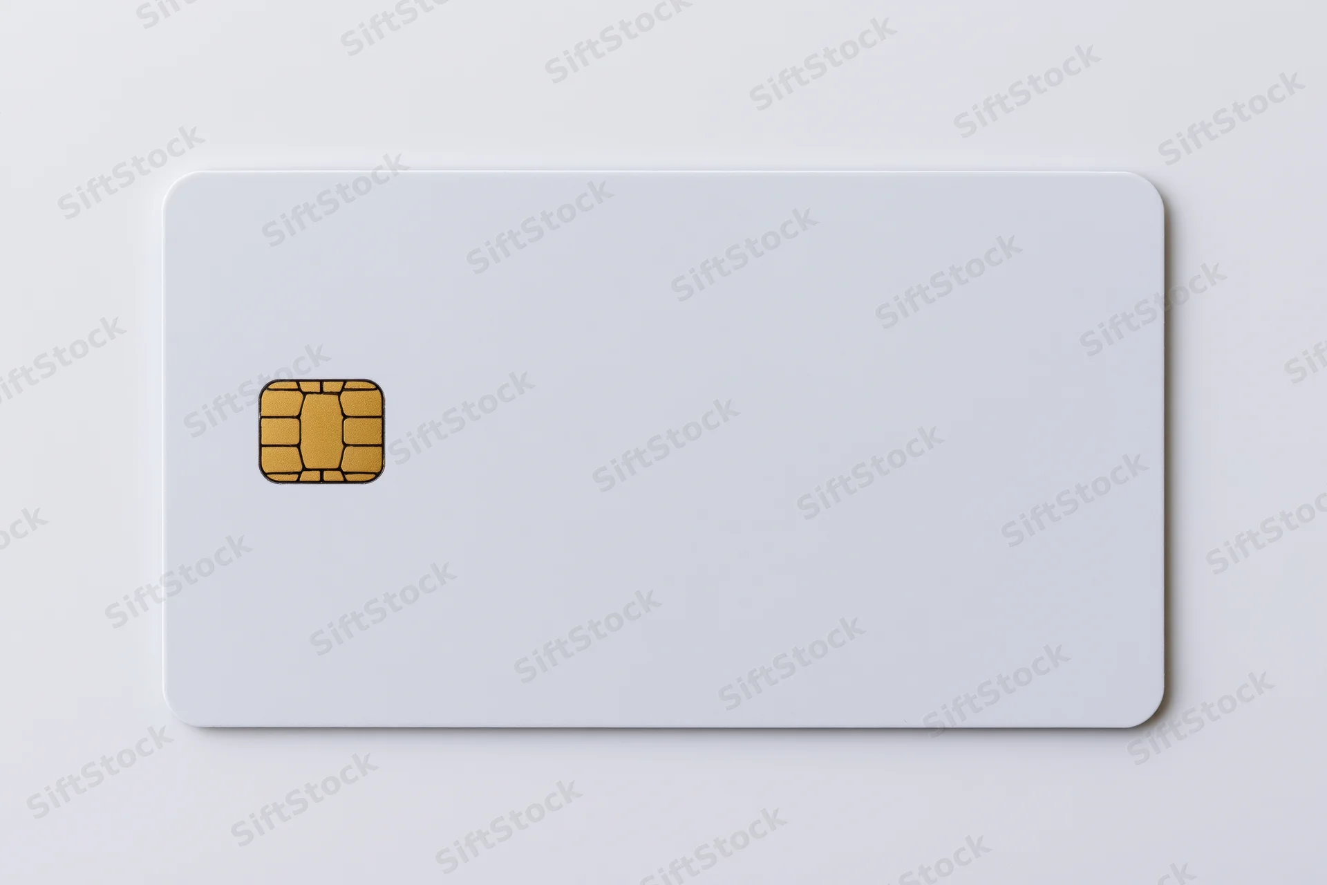 Blank white credit card with gold emv chip on left side against white background