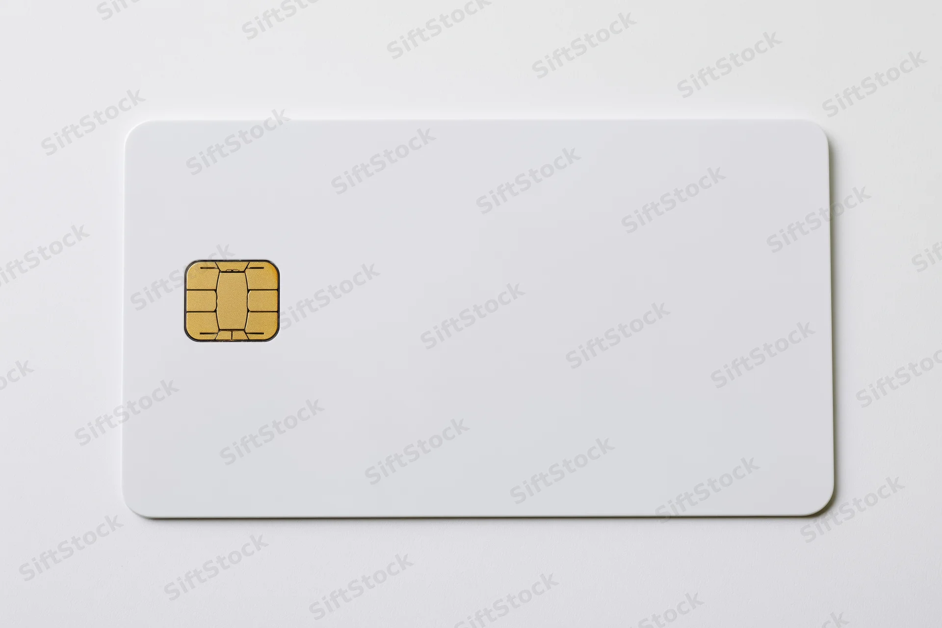 Blank white credit card with gold emv chip on left side isolated on white background